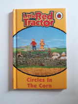 Little red tractor. Circles in the corn